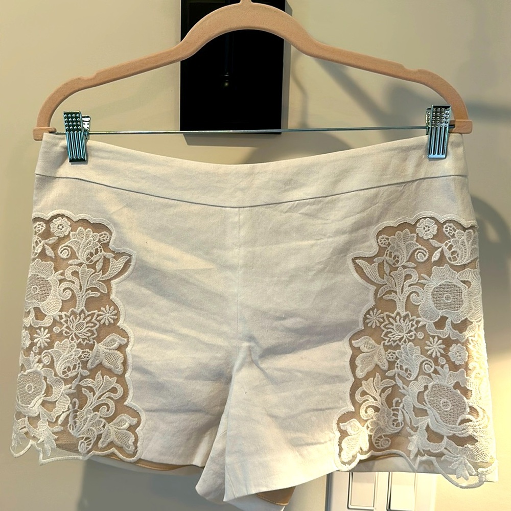 Alice and Olivia white and nude with lace detail shorts.